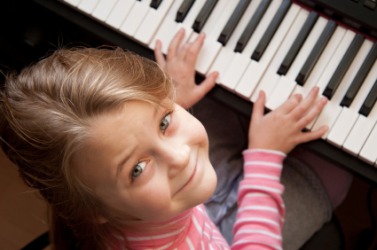 This little girl can play the piano.